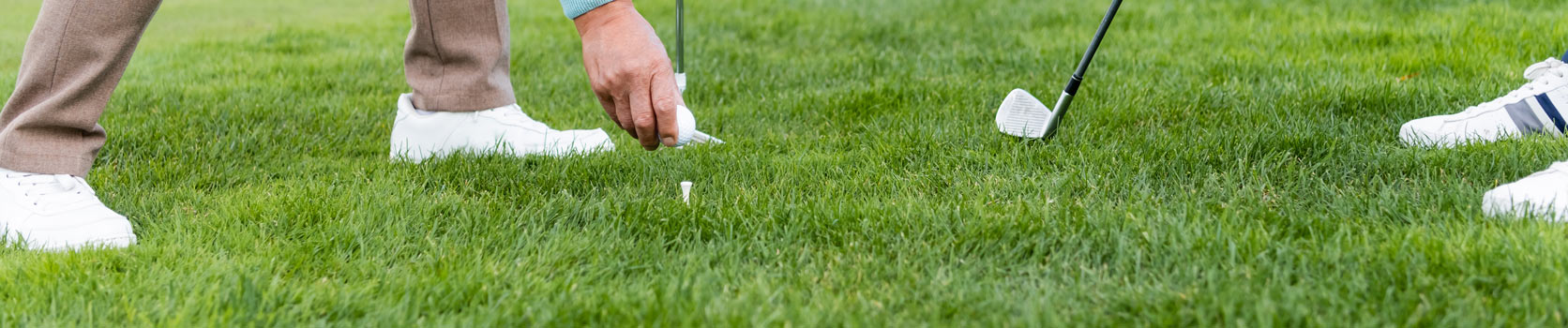 golfers using personalized golf tees from Par Golf Supply on the golf course