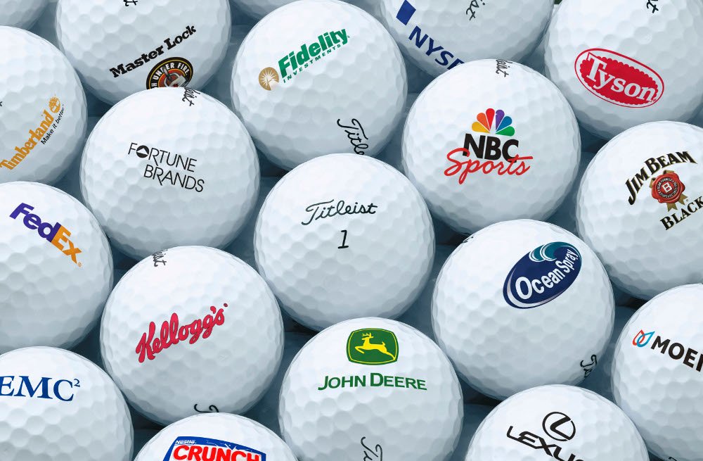 Custom golf balls with different company logos
