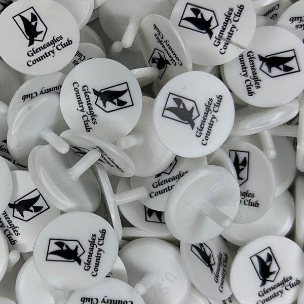 White custom ball markers printed with a black company logo