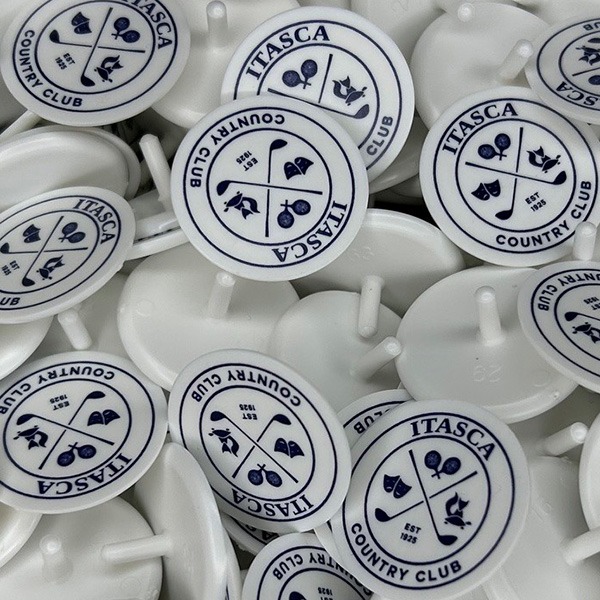 Custom golf ball markers printed with a country club logo