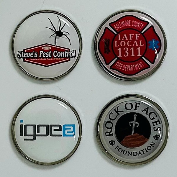 Custom metal golf ball markers featuring assorted full-color logo designs