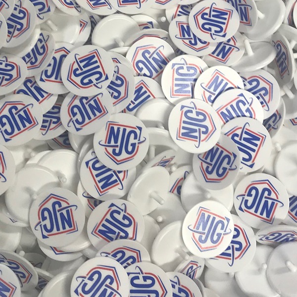 Branded golf ball markers printed with a red and blue logo