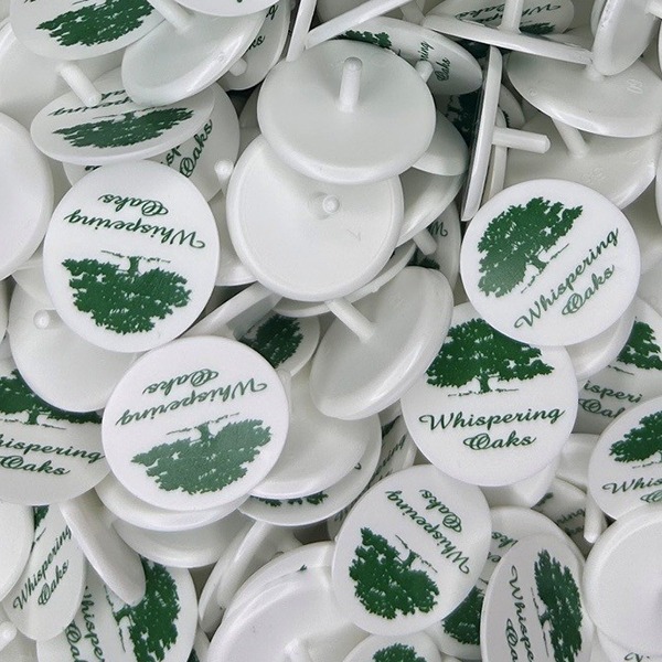 Personalized golf ball markers printed with a green tree design