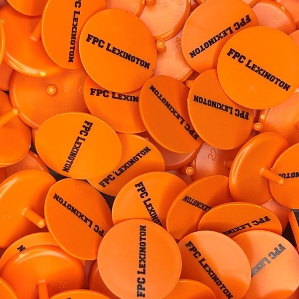 Orange Custom golf markers printed with company branding