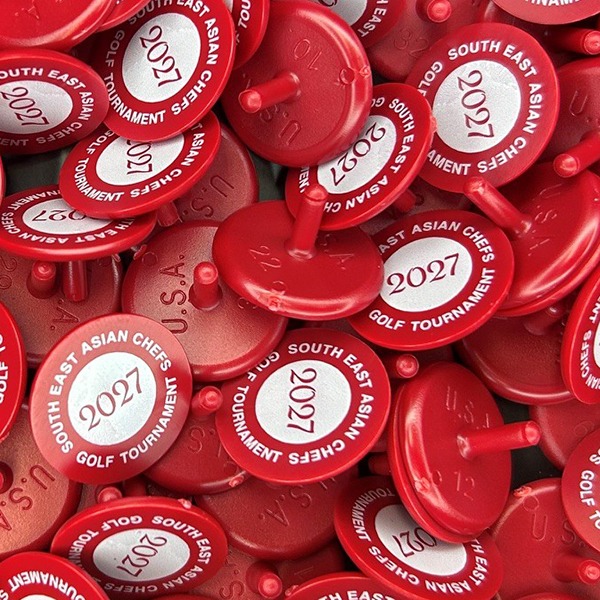 Red Personalized golf markers printed with company branding