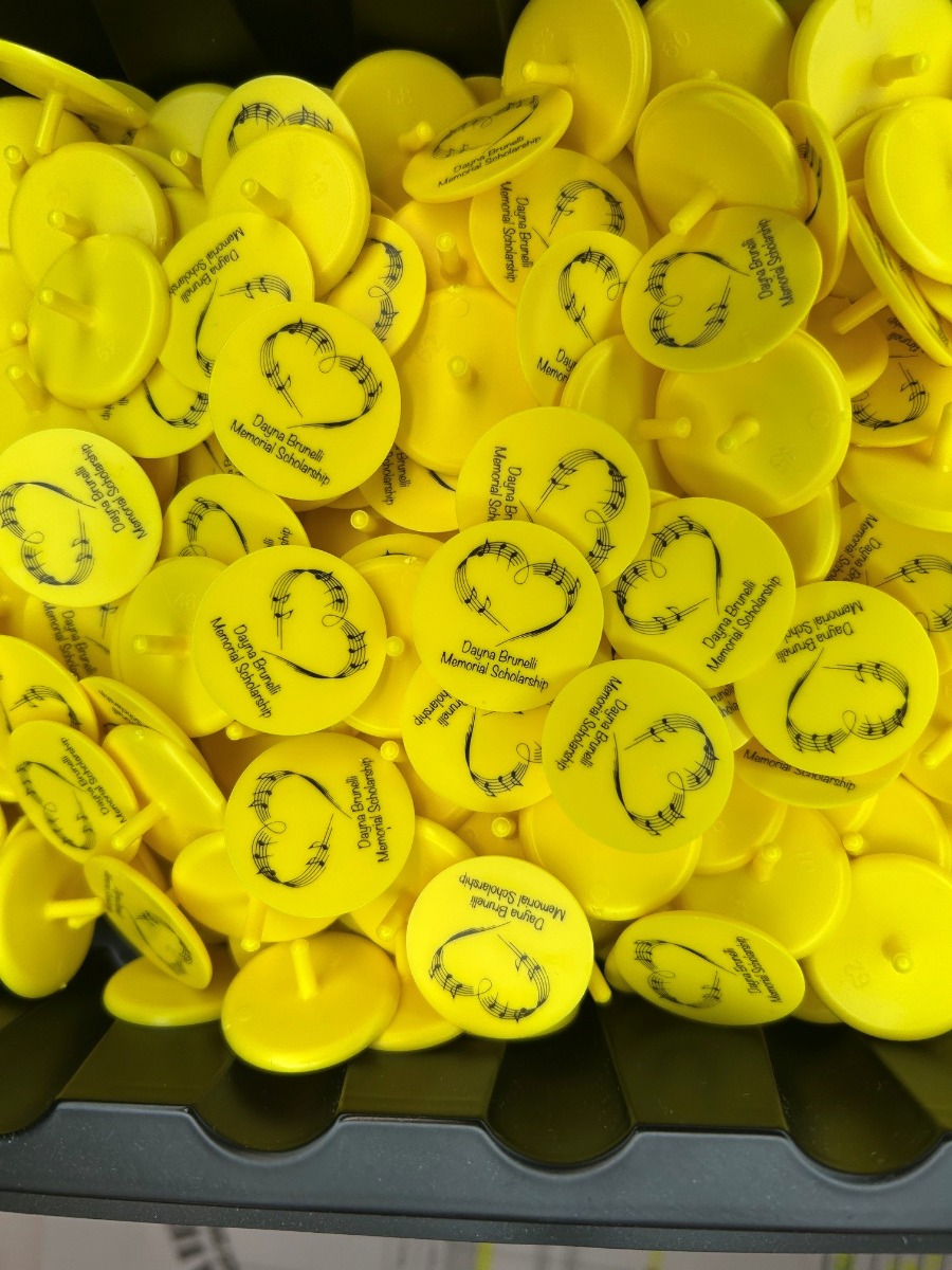Yellow Custom ball markers printed with a memorial celebration
