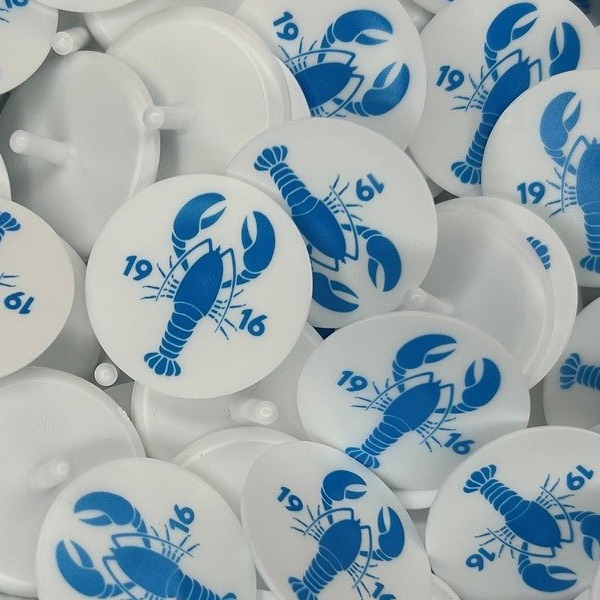 White custom ball markers printed with a blue lobster design