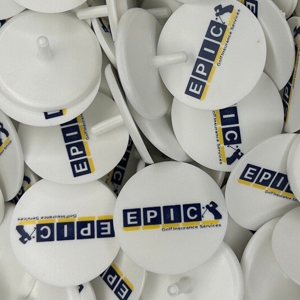 White custom ball markers printed with a full-color company logo
