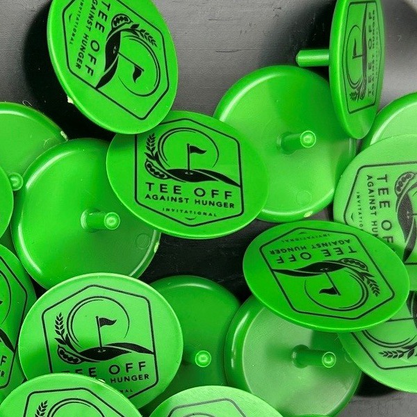 Green personalized golf markers printed for a charity golf event