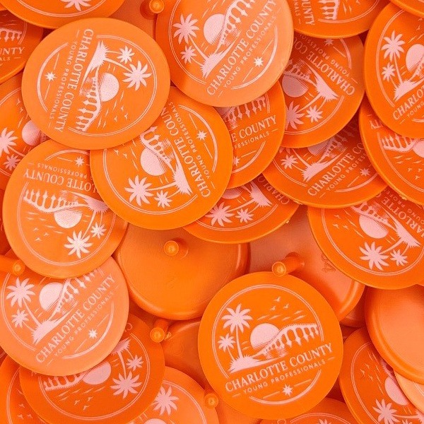 Orange custom golf markers printed with a white county logo
