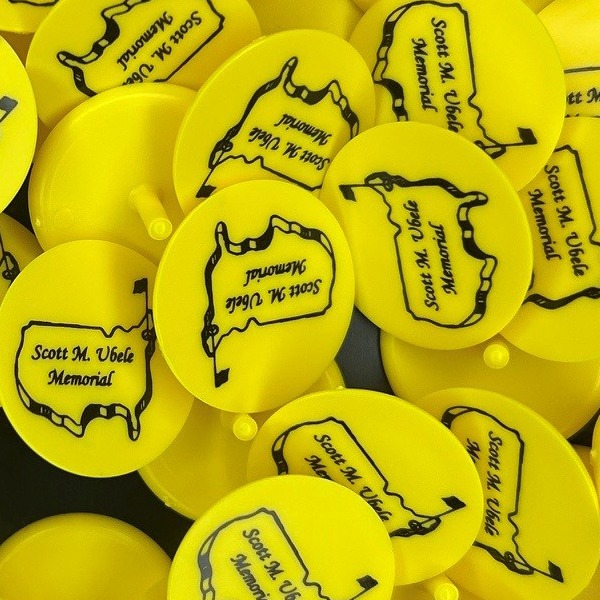 Yellow custom golf markers printed for a memorial golf outing