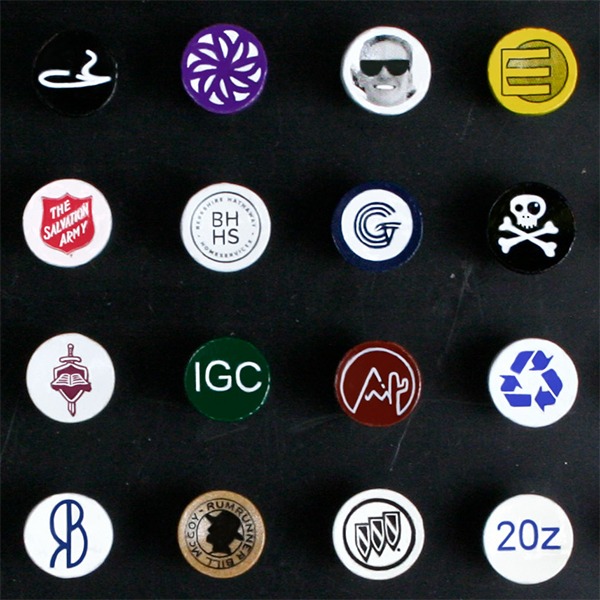 Bulk cup-imprinted golf tees featuring assorted colorful logo designs