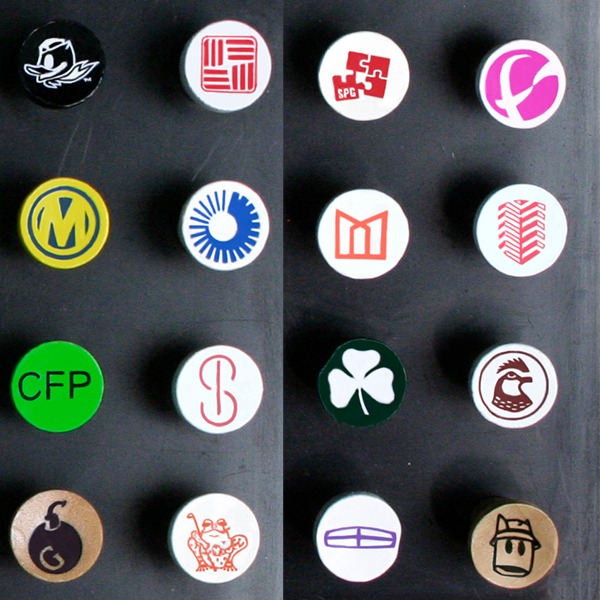 Personalized golf tees featuring assorted custom cup imprint designs
