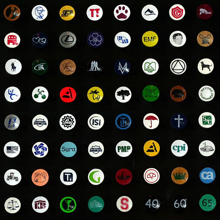 Wholesale cup-imprinted golf tees featuring assorted custom logos