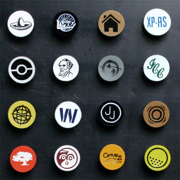 Branded cup-imprinted golf tees showcasing assorted logo designs