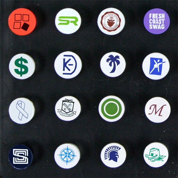 Bulk golf tees featuring assorted custom logos printed on the tee cups