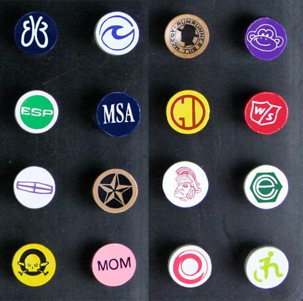 Branded golf tees showcasing assorted custom cup imprint designs