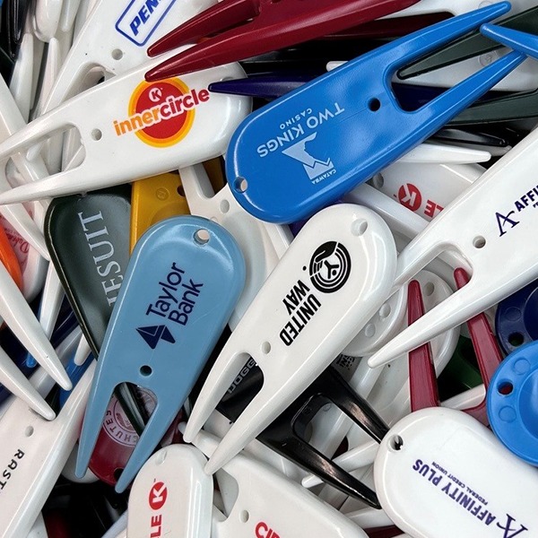 Personalized divot tools in assorted colors with custom company logos