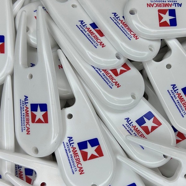White logo divot tools printed with red and blue custom branding