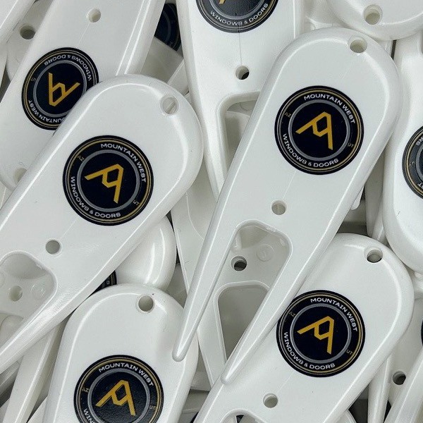 Personalized divot repair tools printed with company branding 