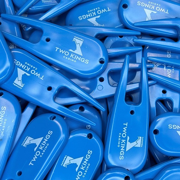 Blue personalized divot tools printed with white company branding