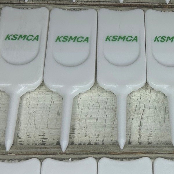 White personalized divot repair tools printed with company branding 