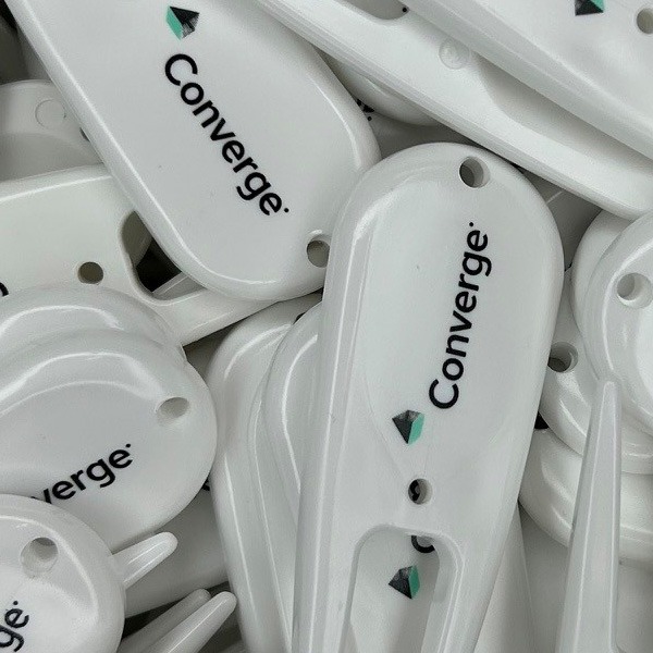 White custom divot repair tools printed with company branding 