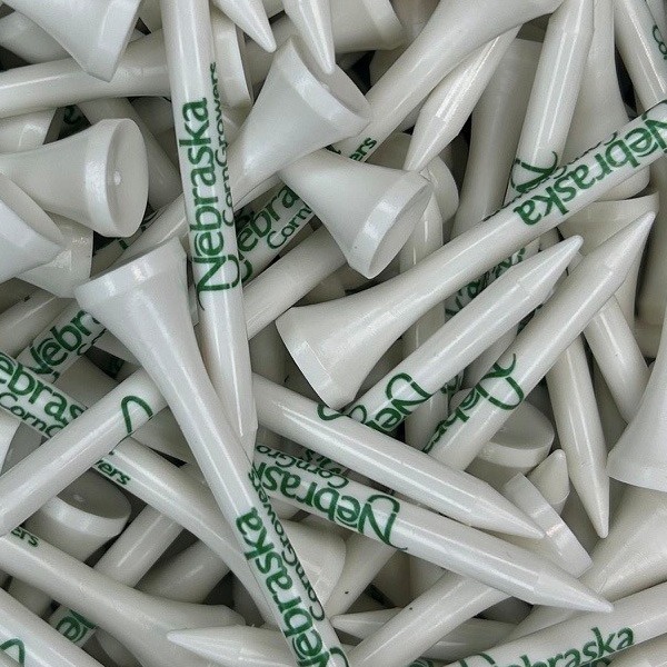 White custom logo golf tees printed with green company branding