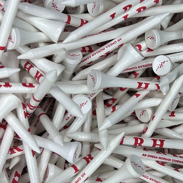 White custom golf tees printed with red logos and lettering