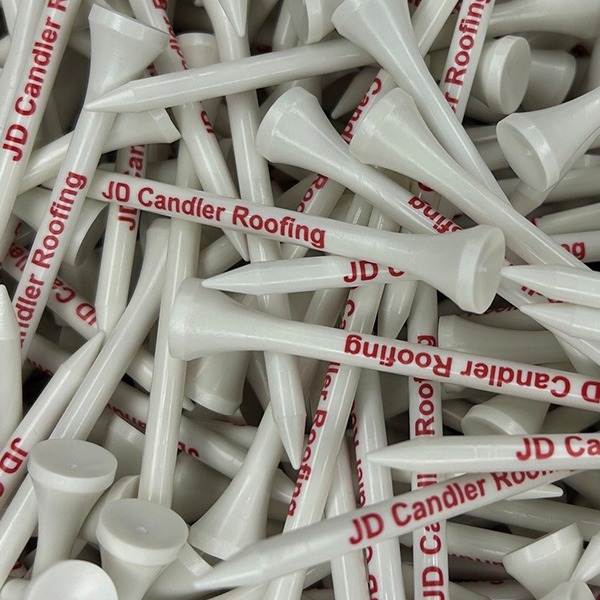 White bulk golf tees printed with a red company name
