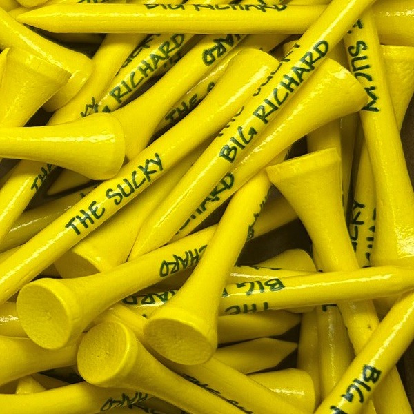 Yellow custom golf tees printed with black lettering