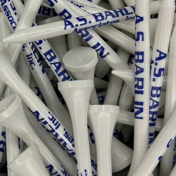 White branded golf tees printed with a large navy company name