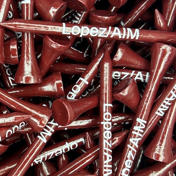 Brown custom golf tees printed with a white company name