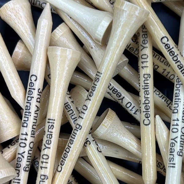 Natural wood golf tees printed for a 110th anniversary celebration
