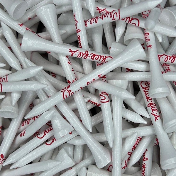 White personalized golf tees printed with red lettering