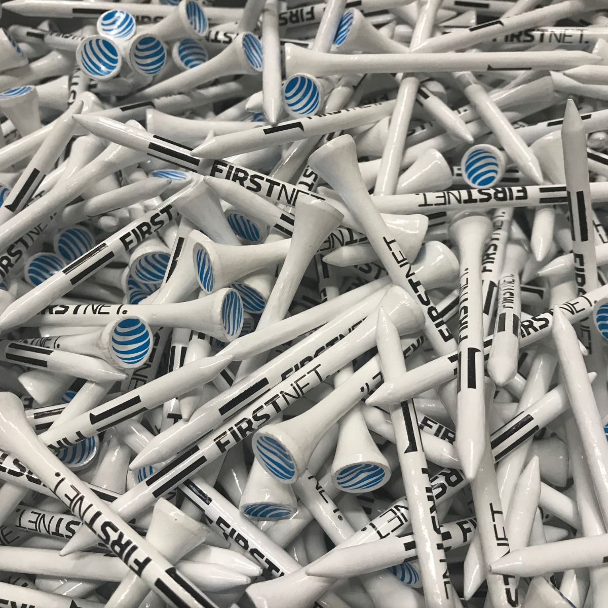 White personalized golf tees printed with company branding
