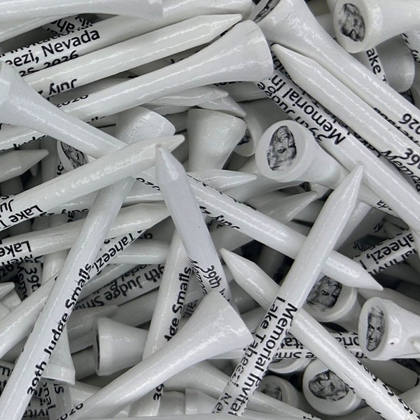 White branded logo golf tees printed with a memorial celebrationl ogo