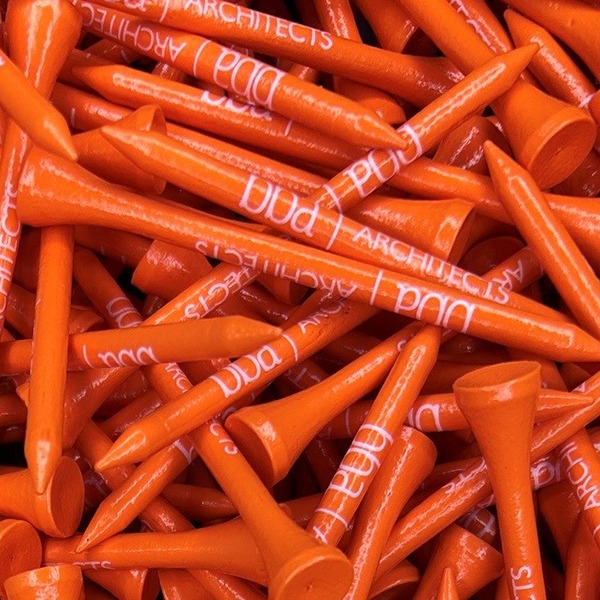 Orange branded logo golf tees printed with company branding