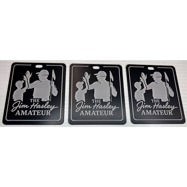 Personalized black golf bag tags with an engraved golfer design