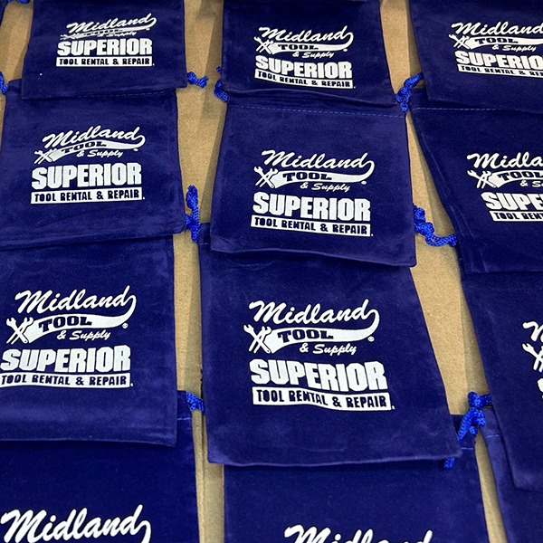 Blue drawstring golf bags printed with a company logo