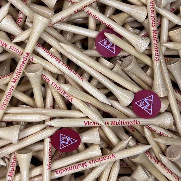 Natural wood personalized golf tees with a purple logo imprint
