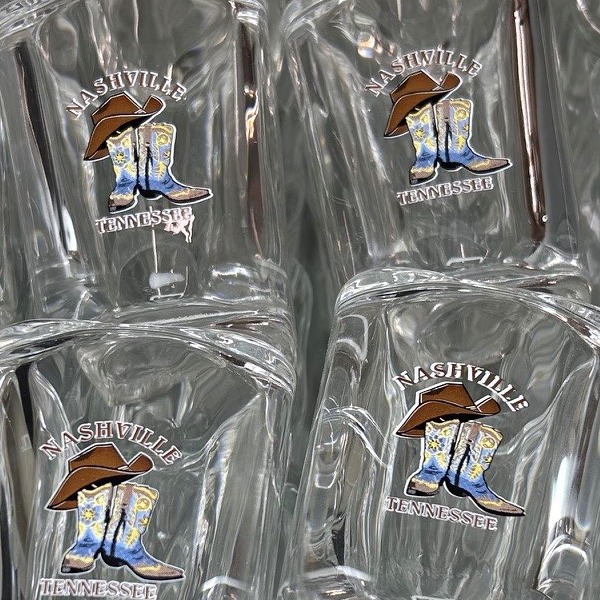 Custom shot glasses printed with a cowboy boot design