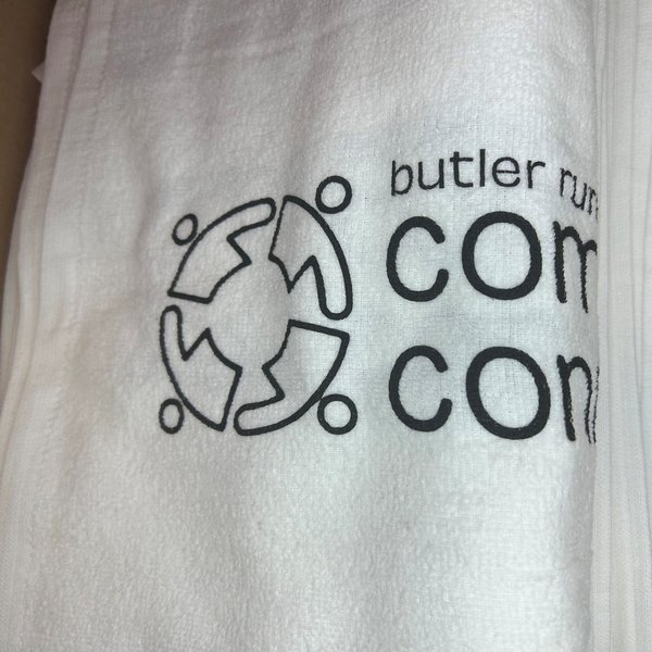 White custom printed golf towel with company branding
