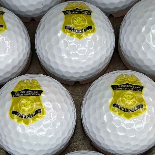 Personalized golf balls printed with a government agency badge