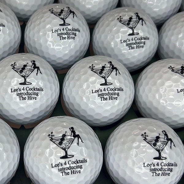 Personalized golf balls printed with a golf and cocktail design