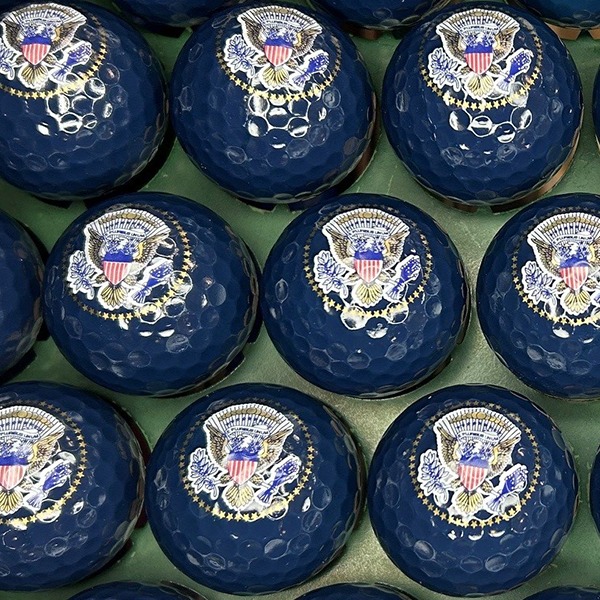 Navy blue personalized golf balls featuring a patriotic American design