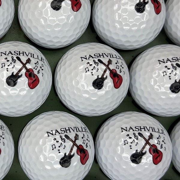 Personalized city-themed golf balls featuring a custom music design