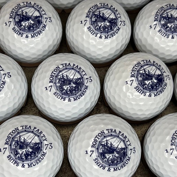 Personalized golf balls featuring a historic commemorative design