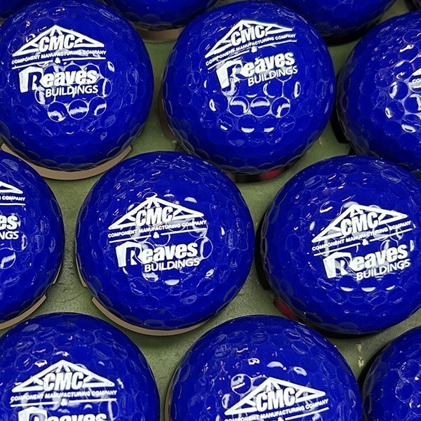 Blue custom golf balls printed with a corporate event logo