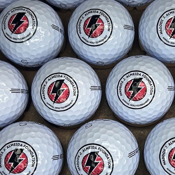 Custom golf balls printed with a golf tournament logo